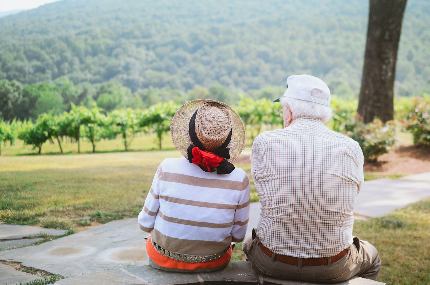 Couple sitting together on a pathway